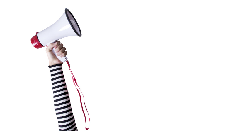 young woman holding megaphone